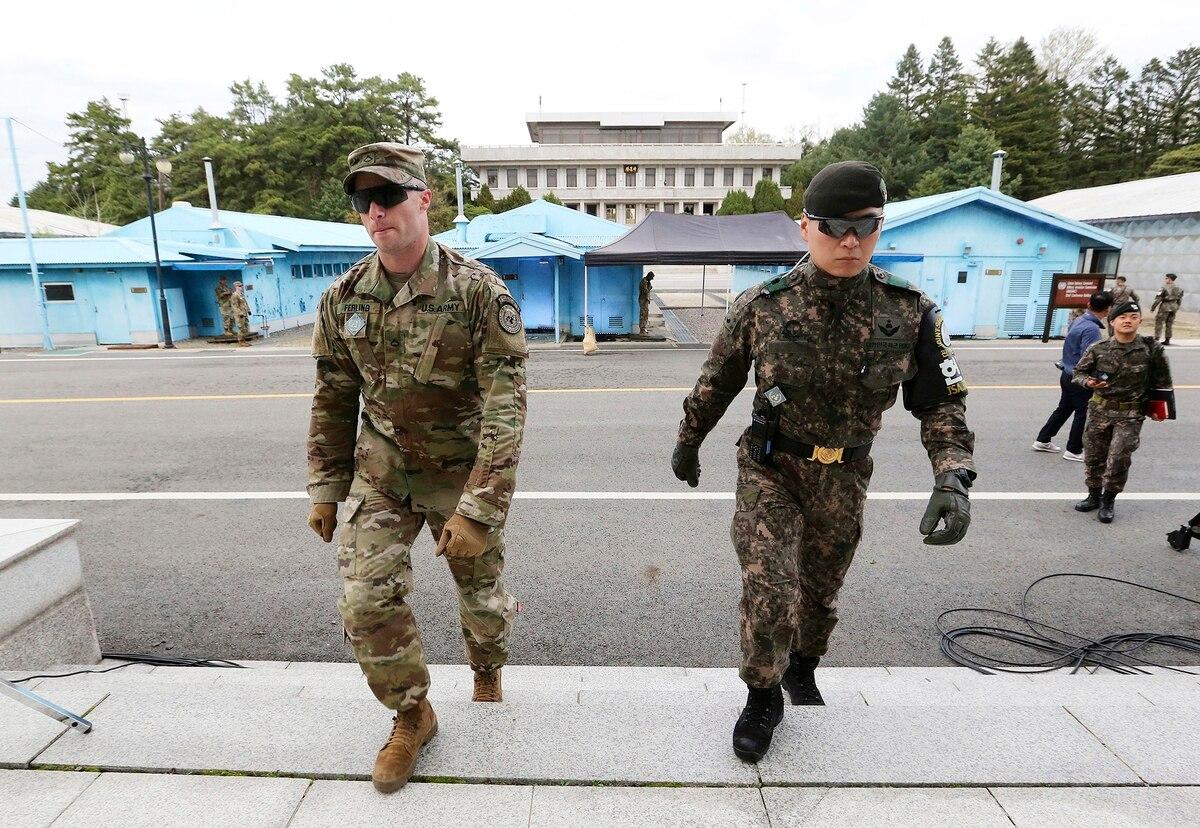 In this April 26, 2019, file photo, South Korean and U.S. Army soldiers patrol during a rehearsal to mark the first anniversary of a summit between South Korean President Moon Jae-in and North Korean leader Kim Jong Un on  Seoul agrees to pay more for hosting American troops in 2021