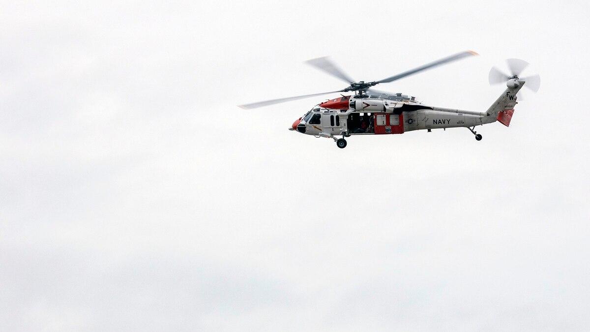An MH-60S Seahawk helicopter assigned to Naval Air Station Whidbey Island Search and Rescue flies over Naval Station Everett during a training exercise Nov. 5, 2020. (MC3 Ethan Soto/Navy) Navy helicopter crew rescues pilot, passenger after small plane crash in Washington state