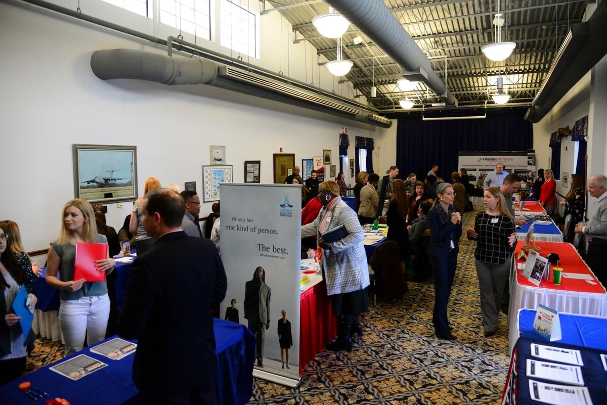 DoD is hosting its fifth annual military spouse symposium starting April 27. Pictured here, spouses interact with local employers during the career information fair segment of a spouse symposium in 2018 at Dover Air Force  DoD military spouse symposium to offer strategies for careers, relationships
