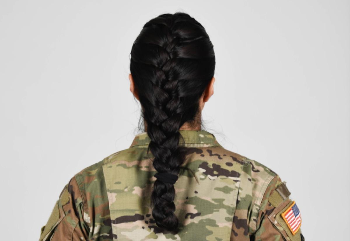 U.S. Army soldier wearing new approved ponytail hair style. (Army) Army to allow ponytails, braids for women