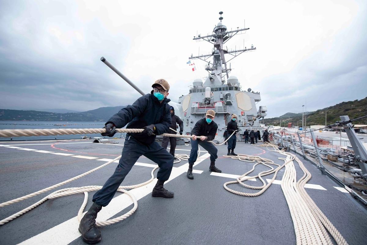 Sailors heave in line as the Arleigh Burke-class guided-missile destroyer Mitscher prepares to depart Souda Bay, Greece, March 24. (MC2 Kaleb Sarten/Navy) More sailors undergoing a forced rating conversion can now separate early