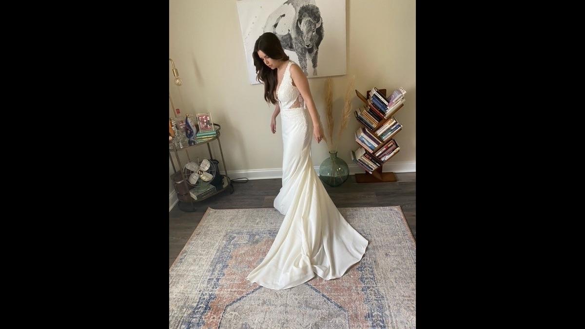 A model wears one of the free gowns offered in the Operation Deploy Your Dress: Bridal, in a new program for the military community. She was a 'pilot bride' who tested the process. (Courtesy Operation Deploy Your Dress) Free new wedding gowns? Check out this program for the military