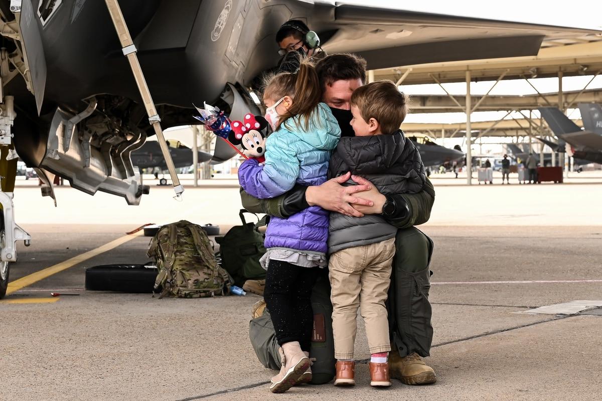 An unidentified F-35A pilot with the 421st Fighter Squadron reunites with his family at Hill Air Force Base, Utah, Oct. 23, 2020, following a six-month deployment to Al Dhafra Air Base, United Arab Emirates. (R. Nial Brads Special leave accrual may continue for service members affected by pandemic restrictions