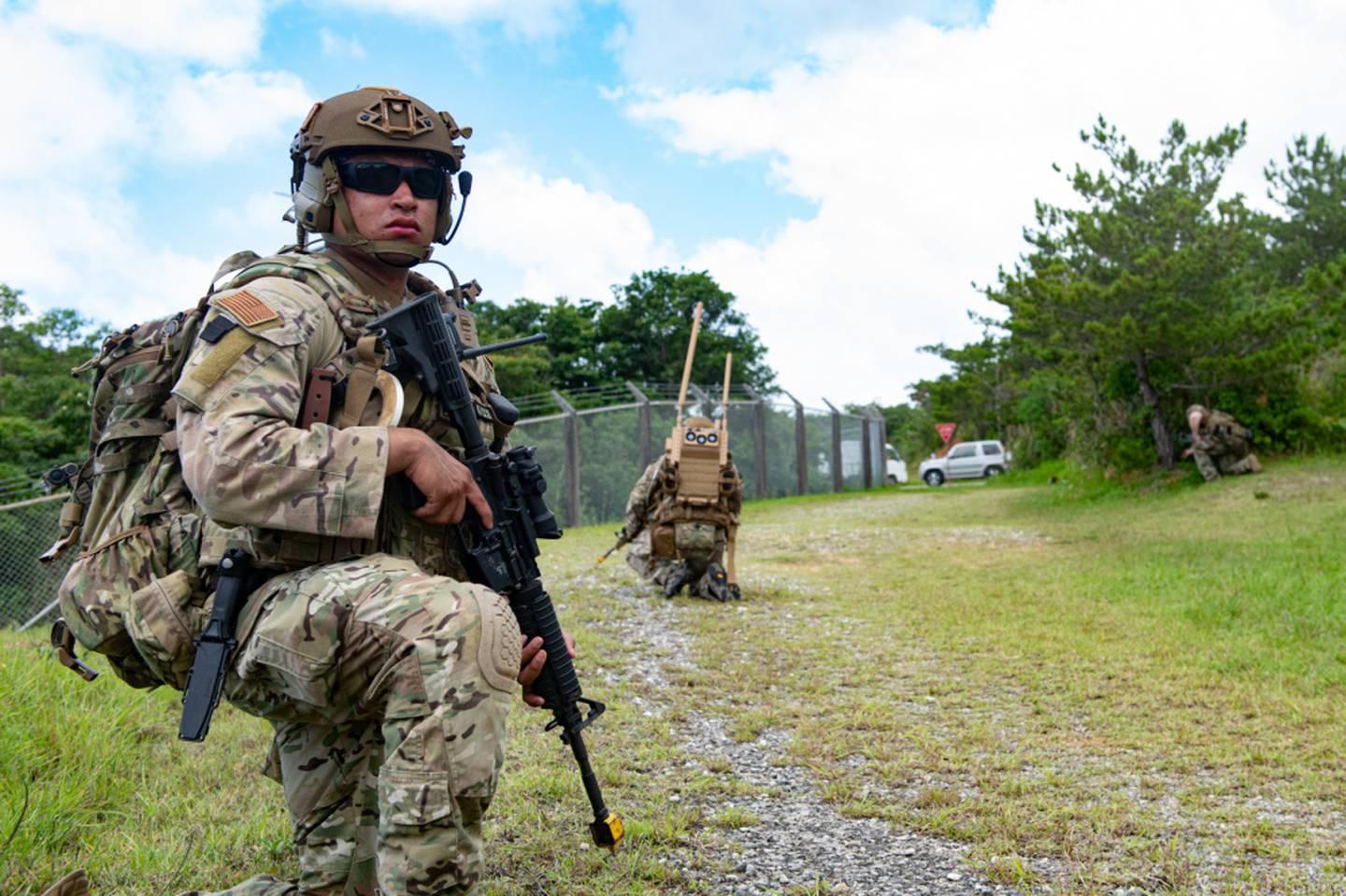 Senior Airman Miguel Ramirez, an Explosive Ordnance Disposal technician from the 18th Civil Engineer Squadron, provides security while on patrol during an Improvised Explosive Device training event on Kadena Air Base, Japa Enlisted airmen can earn up to $360,000 in retention bonuses in these fields