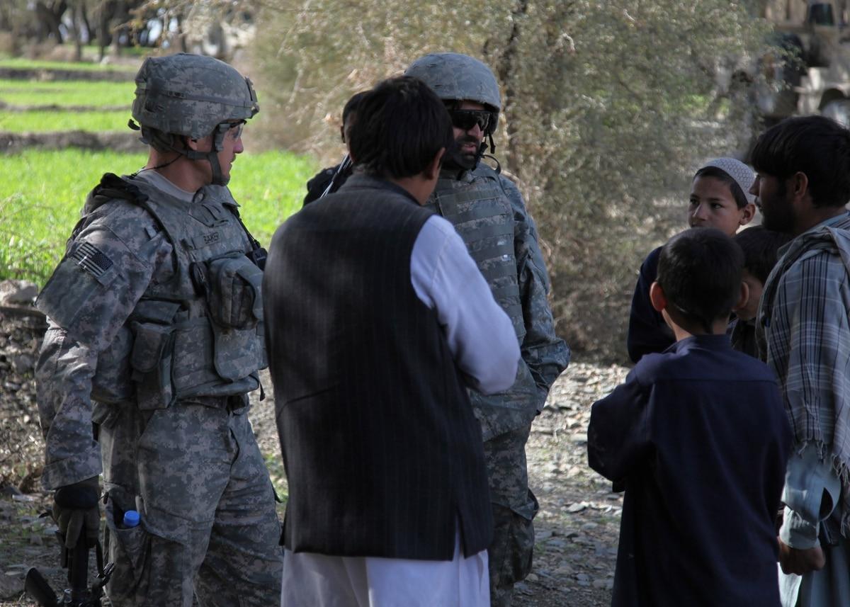 A group of local Afghan villagers speak to an interpreter, greeting U.S. Army soldiers. (U.S. Army photo by Spc. Victor Egorov) â€˜Welcome homeâ€™: Evacuation flight brings 200 Afghans to US