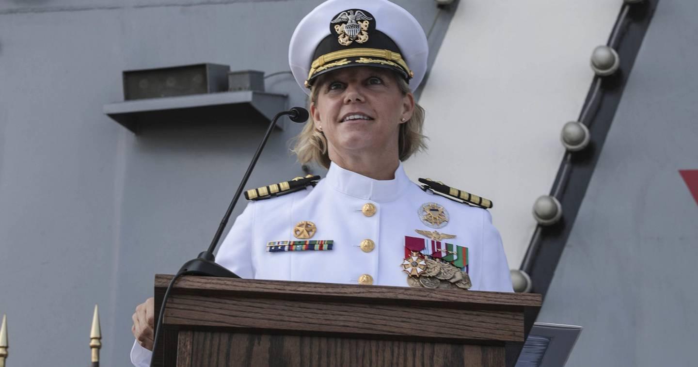 Capt. Amy Bauernschmidt, newly appointed commanding officer of the aircraft carrier Abraham Lincoln, delivers remarks during a change of command ceremony on the flight deck. (MC3 Jeremiah Bartelt/Navy) (USS Abraham Lincoln This Navy captain is now the first woman commanding a nuclear aircraft carrier