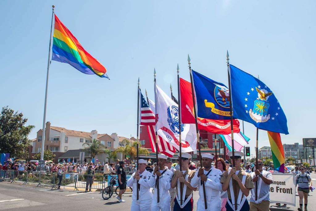 Color Guard members from the Navy and Marine Corps march in the San Diego Pride Parade on July 14, 2018 . (Mass Communication Specialist 3rd Class Nicholas Burgains/Navy)) LGBT vets with other than honorable discharges will get VA benefits under new plan