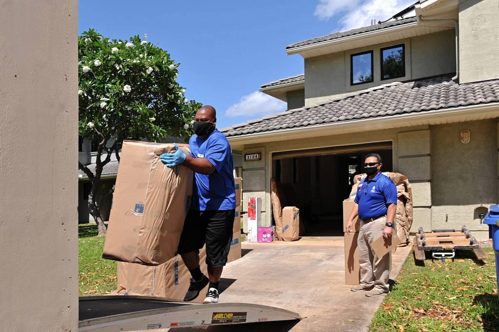 Navy Household Goods Inspector Faata Leafa inspects a pack-out of a military family in Honolulu in May 2020. (Daniel Mayberry/Navy) $6.2 billion contract aims (again) to reform household goods moves for troops, families
