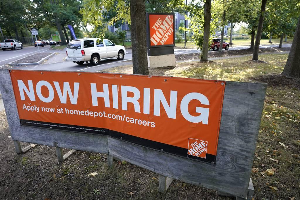 The Home Depot has expanded its military discount program, which is one of its efforts to support the military. More than 35,000 employees are veterans and military spouses. Here, vehicles drive past a 