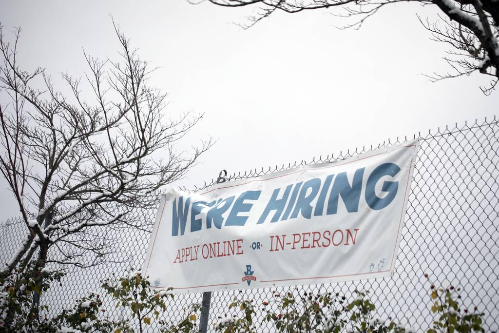 A sign seeking workers is displayed at a fast food restaurant in Portland, Ore., on Dec. 27, 2021. (Jenny Kane/AP) Veterans unemployment drops to lowest level in two years