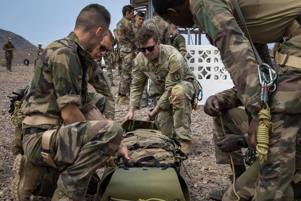 Staff Sgt. John Hampson, an instructor at the U.S. Army Mountain Warfare School, instructs French troops on casualty evacuation techniques at Arta Beach, Djibouti, Dec. 14, 2021. Less than two weeks later, he saved three f Vermont Guard soldier saves 3 from frozen lake on Christmas Day