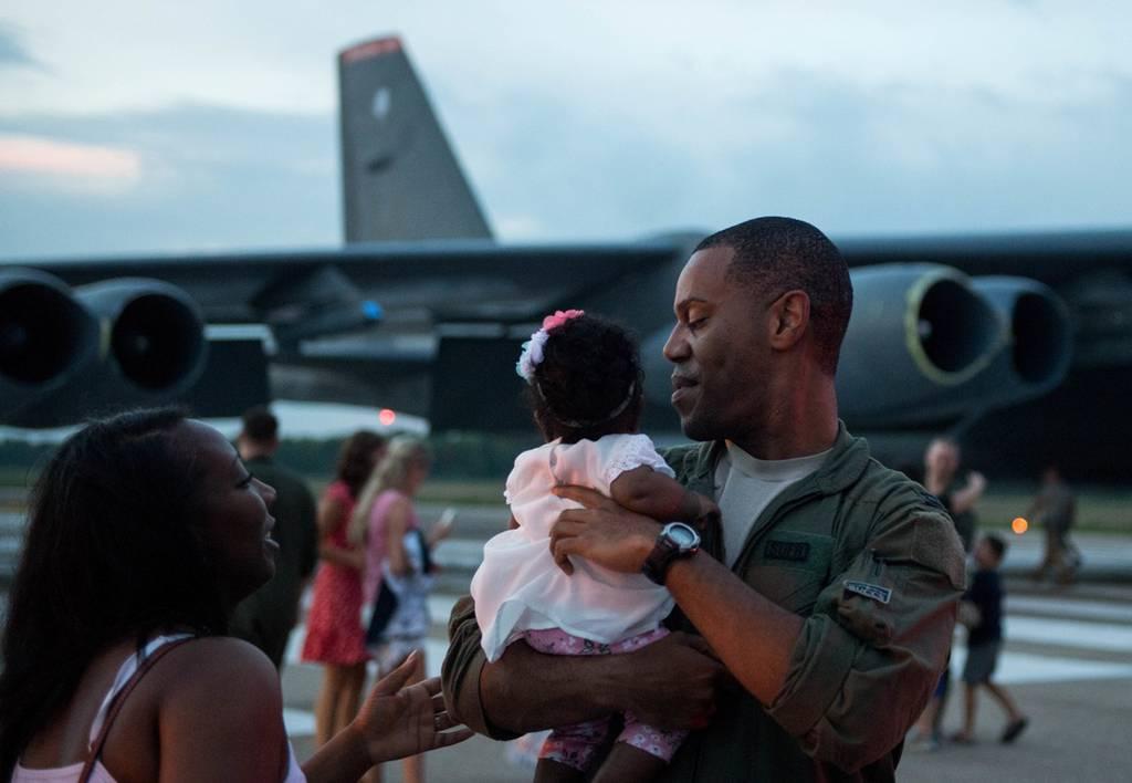 Capt. Donovan Carroll, 20th Bomb Squadron, embraces his daughter Colby for the first time at Barksdale Air Force Base, La., July 12, 2018. His wife Bree was six months pregnant with Colby when Carroll left for his deployme Air Force parents choose how to care for their children, not commanders, service says