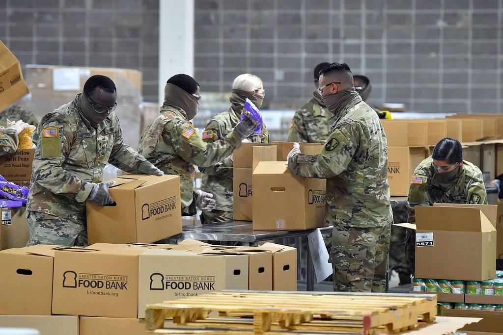 Louisiana National Guard soldiers preparing food boxes for distribution in the local area during the COVID-19 response in Baton Rouge, Louisiana, April 23, 2020. (Air Force/Master Sgt. Toby Valadie) Bill would help National Guard, Reserve members get benefits