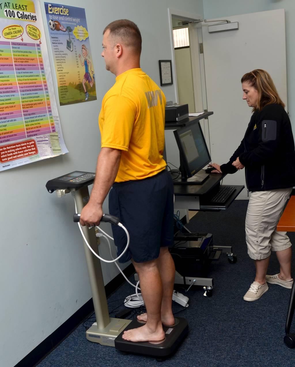 Misty Carman, a nurse educator at Naval Hospital Jacksonvilleâ€™s Wellness Center, used a body analyzer scale, which estimates body composition (including body fat, lean mass, bone mass, and water content), and resting met DoD overhauls its body composition and fitness policy
