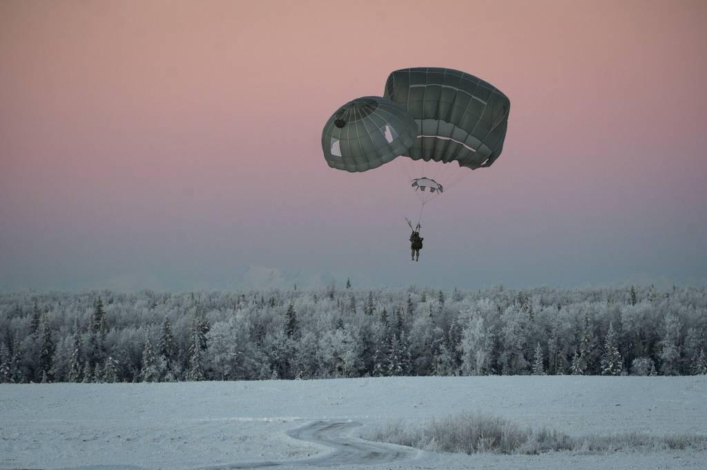 A paratrooper assigned to the 4th Infantry Brigade, 25th Infantry Division, jumps over Malemute Drop Zone, Joint Base Elmendorf-Richardson, Alaska, Jan. 9, 2018. (Sr. Airman Curt Beach/Air Force) Arctic Angels? The 11th Airborne Division may replace Army Alaska
