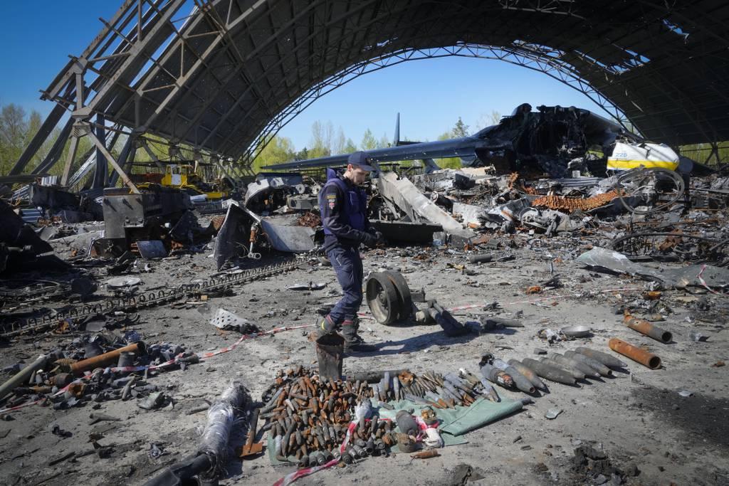 Thumbnail: A Ukrainian servicemember searches for explosives at the Antonov airport in Hostomel, on the outskirts of Kyiv, Ukraine, on May 5, 2022. (Efrem Lukatsky/AP)