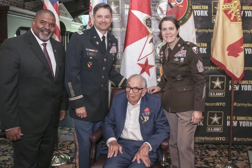 Fort Hamilton garrison leadership poses with World War II veteran Pfc. William Kellerman, who was awarded the Prisoner of War, Purple Heart and Bronze Star medals during a ceremony at Fort Hamilton, N.Y., June 28, 2022. (E Army chief awards WW2 veteran the Purple Heart and Bronze Star