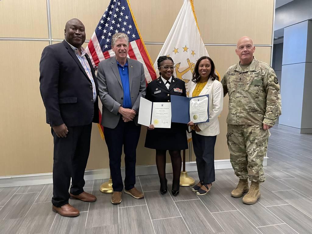 Col. Sharon Harmon, center, is the first Black service member to be promoted to colonel in the Rhode Island National Guard. (Rhode Island Gov. Dan McKee/Twitter)