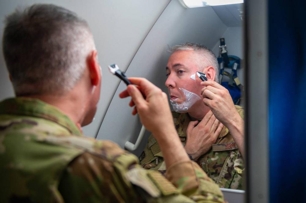 Enlarge Maj. Kevin Rose, 349th Air Refueling Squadron instructor pilot, shaves May 6. Rose was ... 