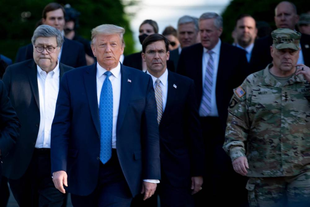 Enlarge President Donald Trump walks with Attorney General William Barr, left, Secretary of Def... 